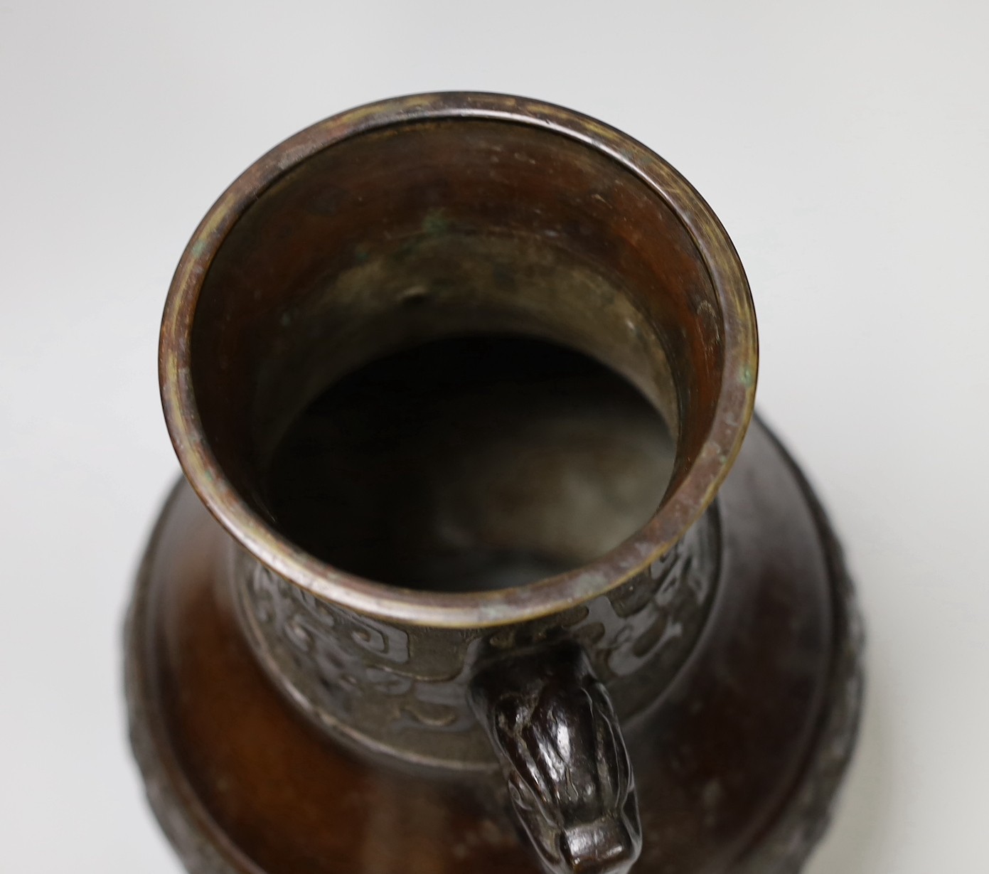 A Chinese archaistic bronze double handled 'hu' vase, 19th century, 27.5cm high